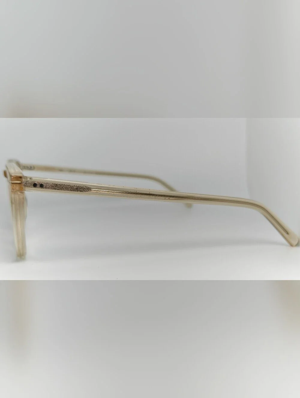 Ona. RFLKT. Clear Beige Round Frame Glasses.